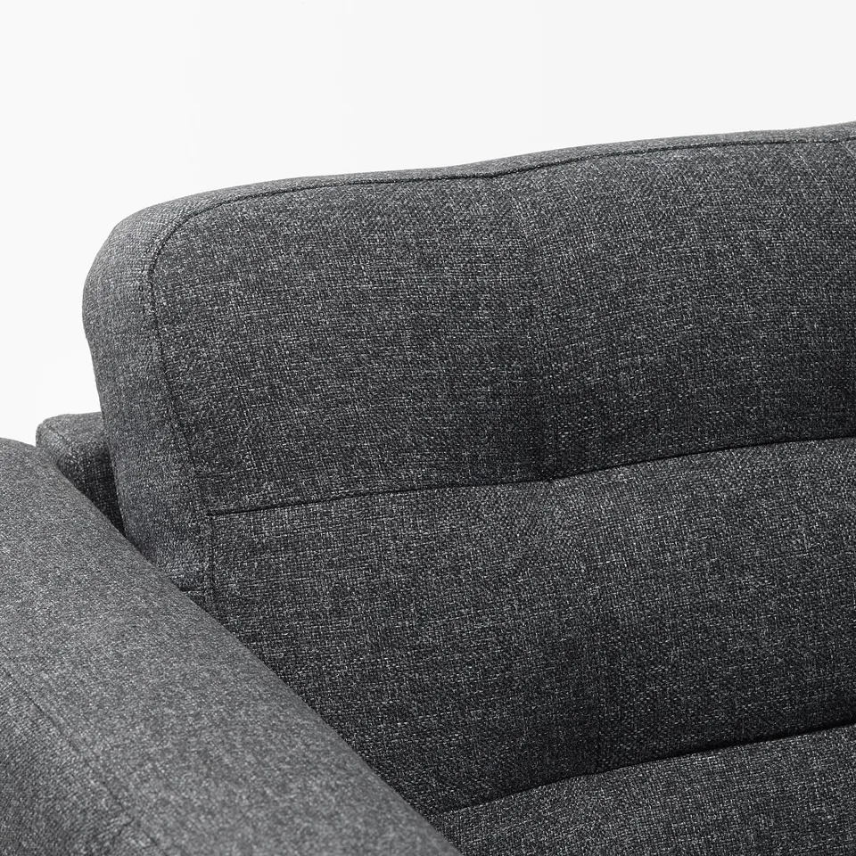 Dark grey fabric sofa with cushioned back and seat, showcasing quality upholstery and comfortable design.