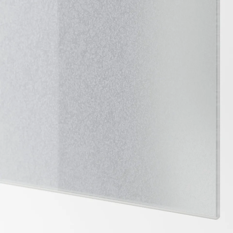 Close-up of smooth, curved frosted glass panel.