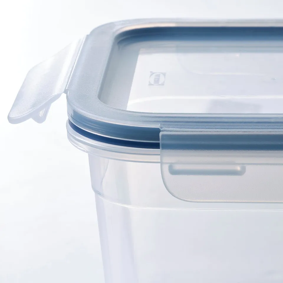 Clear plastic container with lid, showing stacking design, sturdy and durable, ideal for food storage.