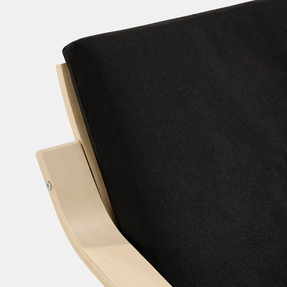Black cushioned chair with wooden frame, focusing on the comfort and support of the seat.