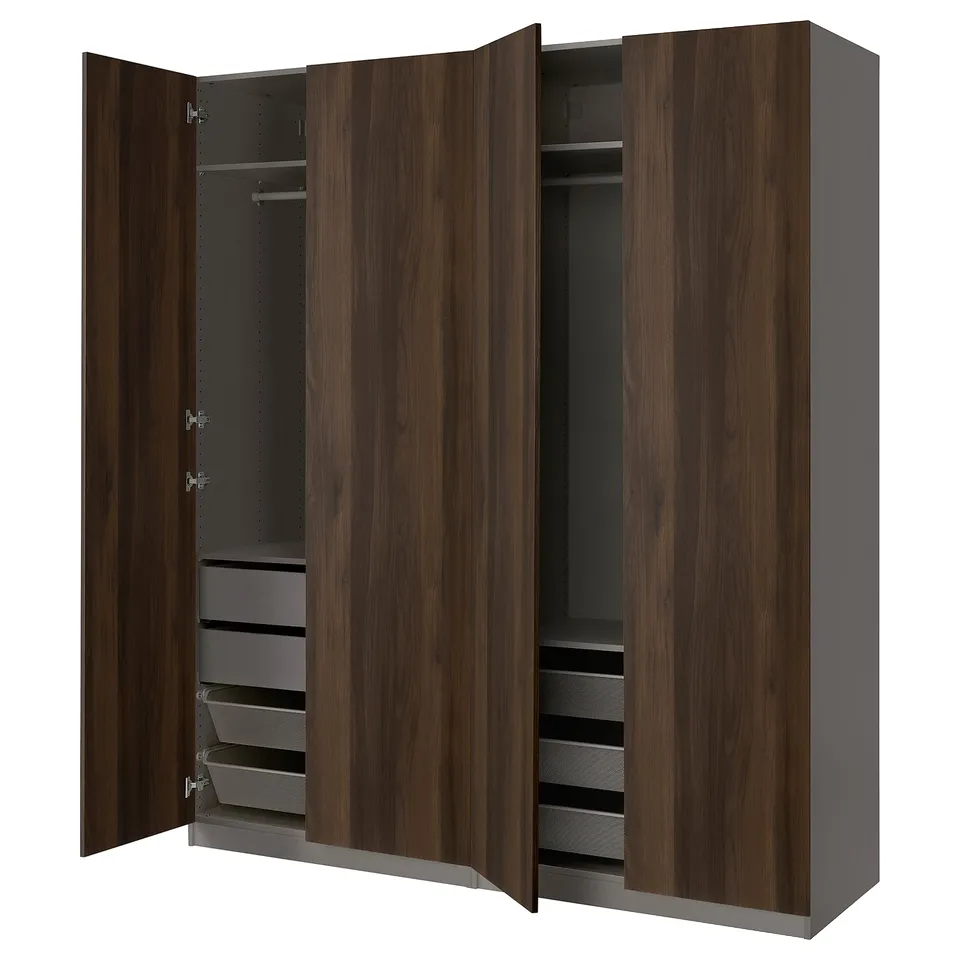 A large, dark brown PAX wardrobe with open doors, revealing shelves and drawers inside.