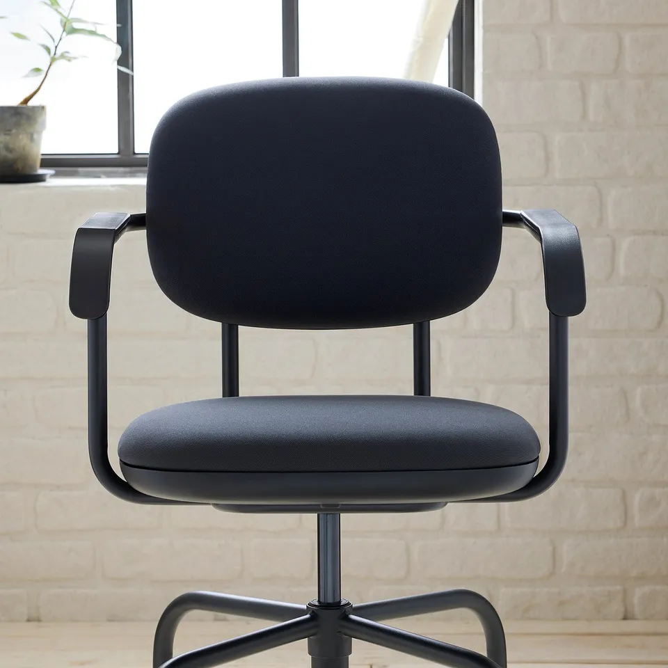 Black modern office chair, upholstered with cushioned seat & back, robust steel frame, adjustable height, and padded armrests.