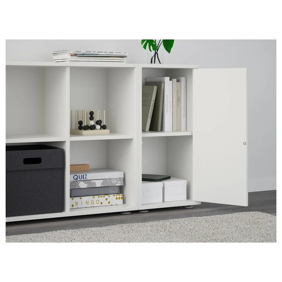 EKET shelf with open/closed storage: records, decor, books, bins, boxes.