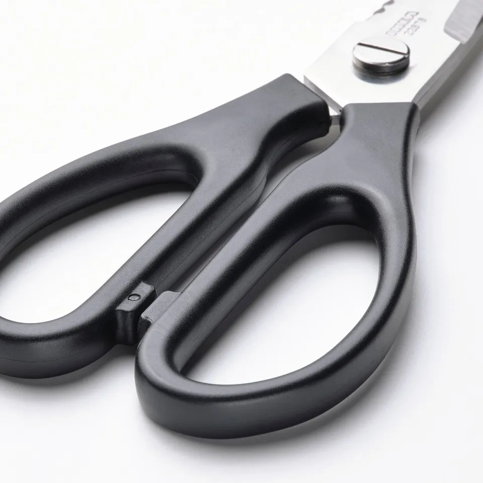 Closed black kitchen scissors with stainless steel blades and comfortable handles. Designed for both right and left-handed users.