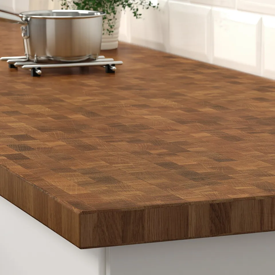 Wooden kitchen counter with end-grain pattern.