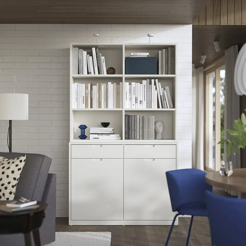 Modern living room with white TONSTAD bookshelf & sideboard, featuring adjustable shelves, closed storage, and sleek, clean lines.