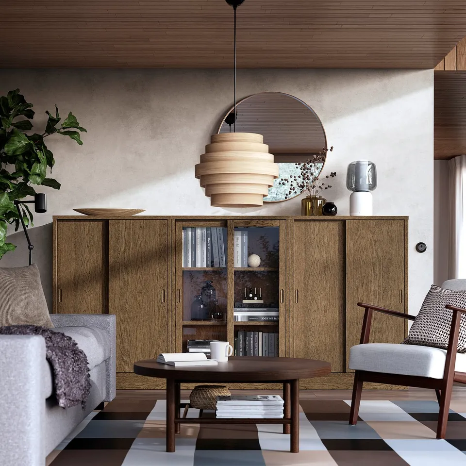Modern living room: TONSTAD cabinet, rug, sofa, coffee table, pendant light, armchair, plants, vases.