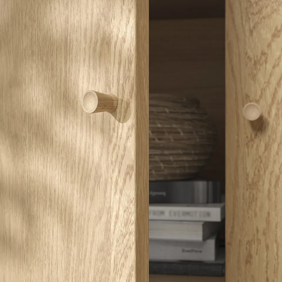 Wooden cabinet with sleek, rounded wooden knobs, showcasing high-quality craftsmanship and natural wood texture.