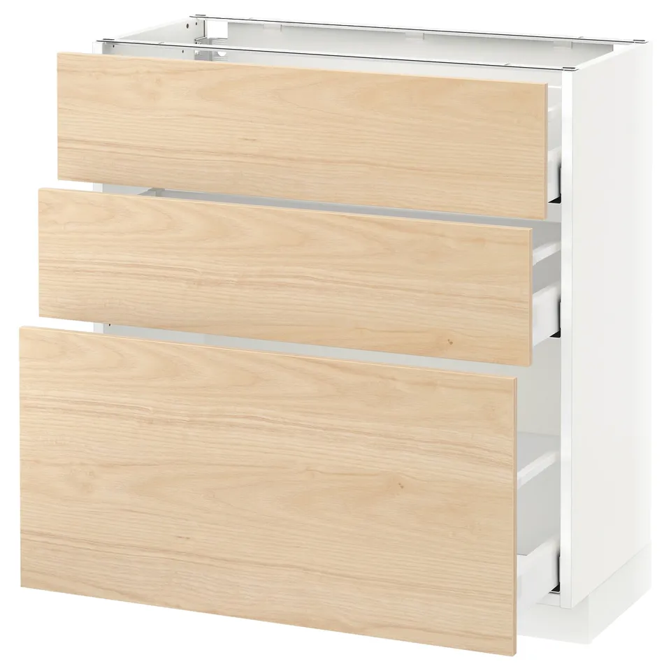 A METOD kitchen unit with three light ash wood drawers and a white base.