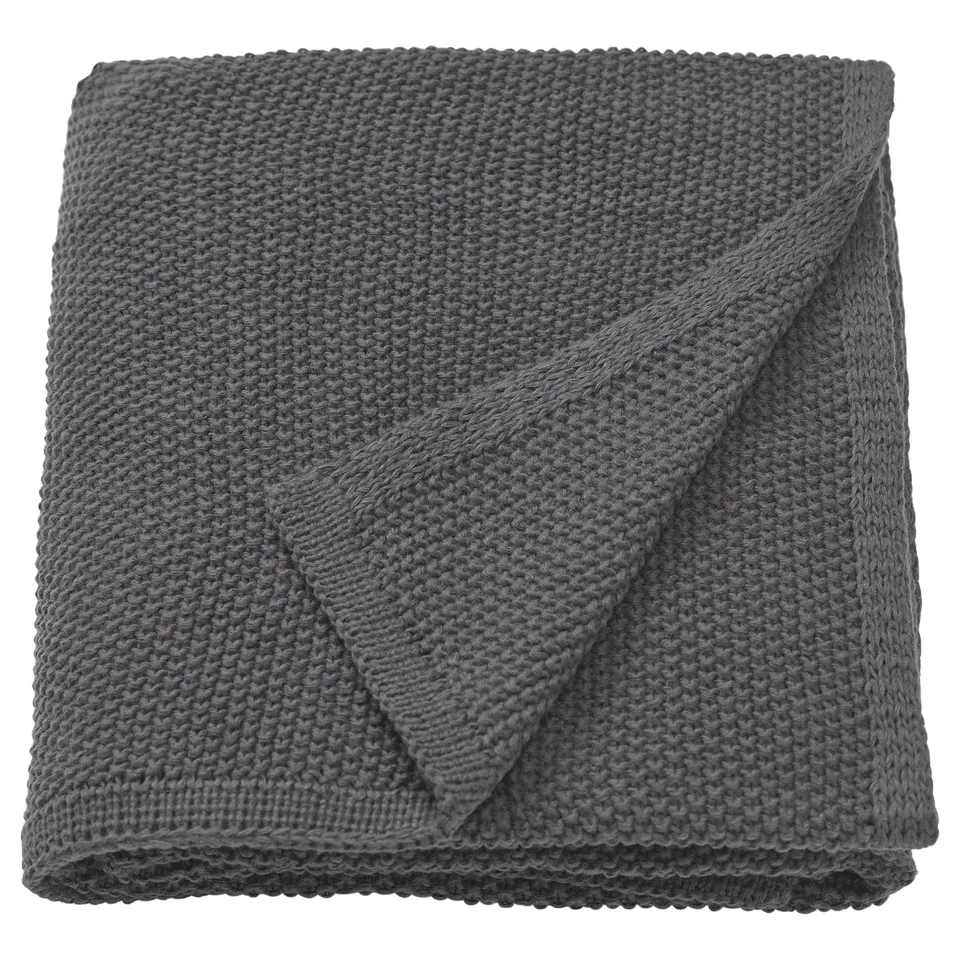 Grey HUMLEMOTT knit throw folded, soft and comforting with recycled polyester texture.