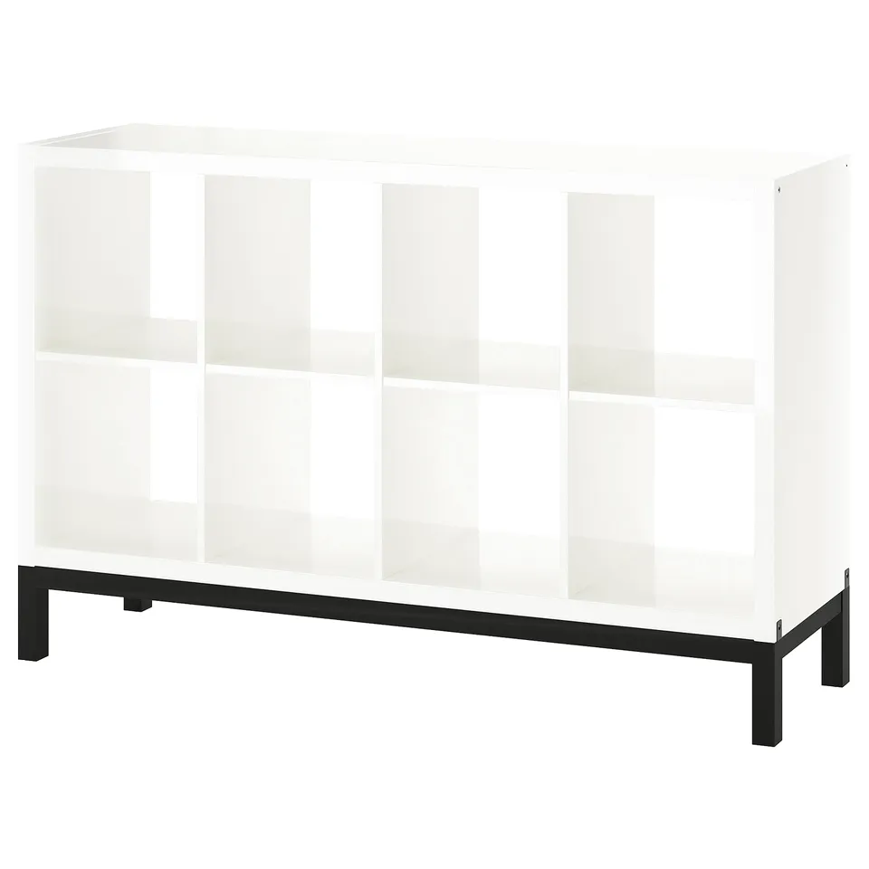 A KALLAX white bookshelf with a black metal base. It has a modern, minimalist design with multiple open shelves.