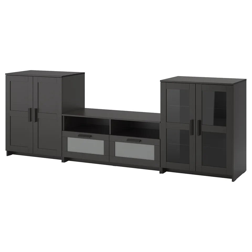 A dark grey BRIMNES tv media unit with a large drawer and two cabinet units. It a sleek modern design with glass doors and cable management.