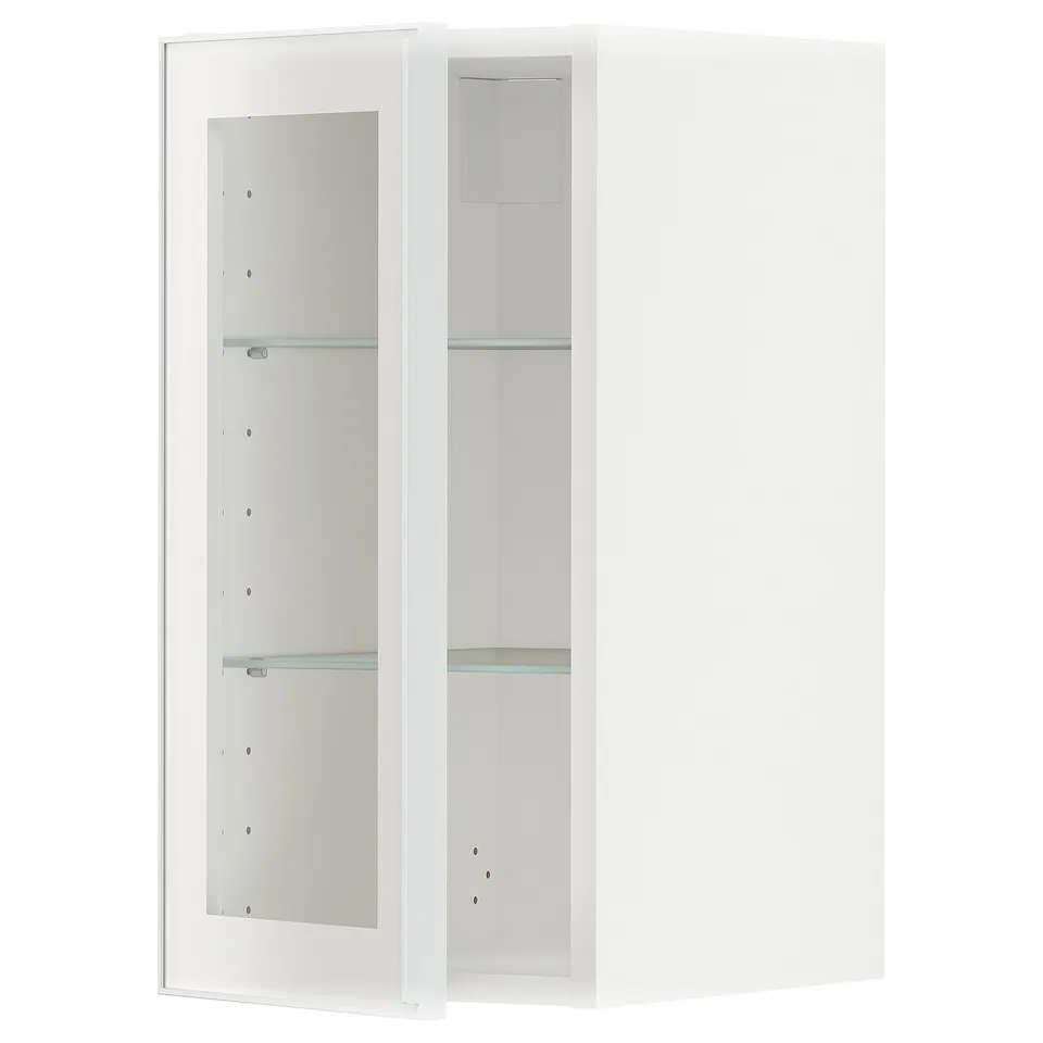 White METOD kitchen cabinet with glass doors and shelves.