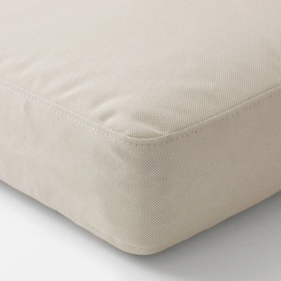 Soft, rectangular cushion seat cover with fine stitching, likely a recycled material.