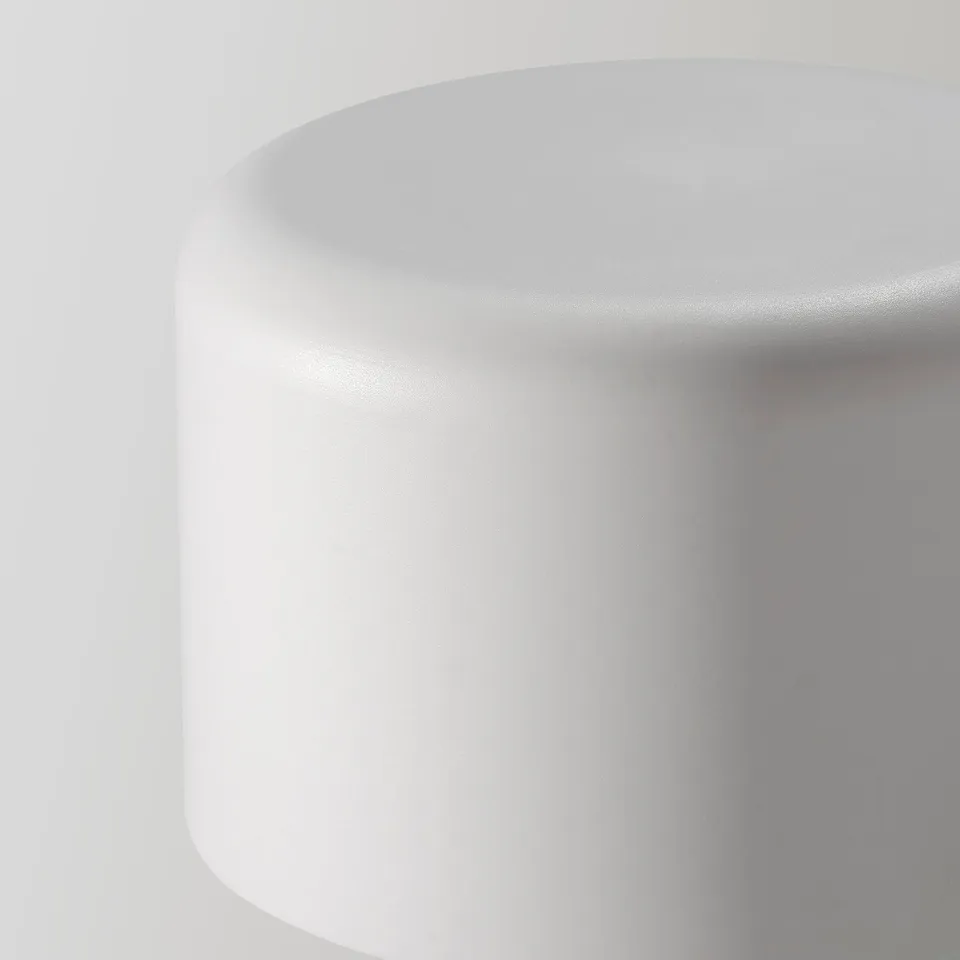 Sleek, white, recycled-plastic finial, smoothly curved, exuding minimalist elegance.