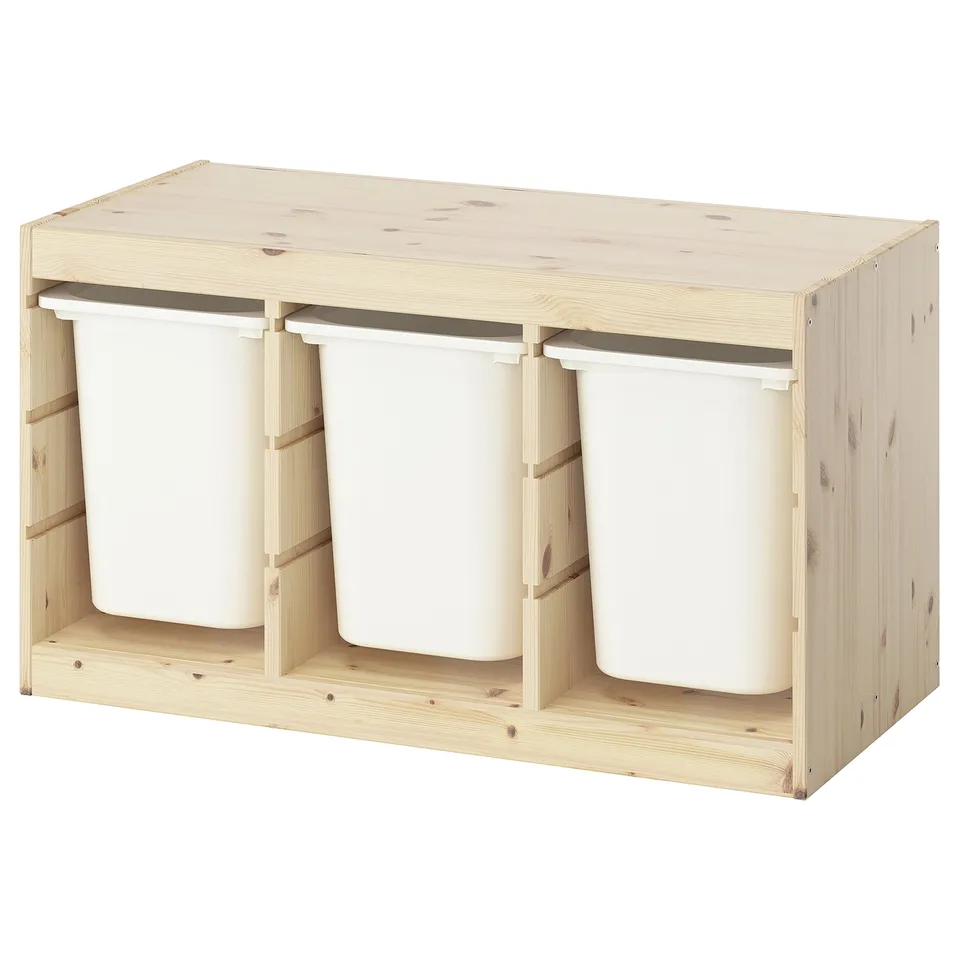 TROFAST light wooden storage with three white plastic bins. Its light-colored with a rectangular design.
