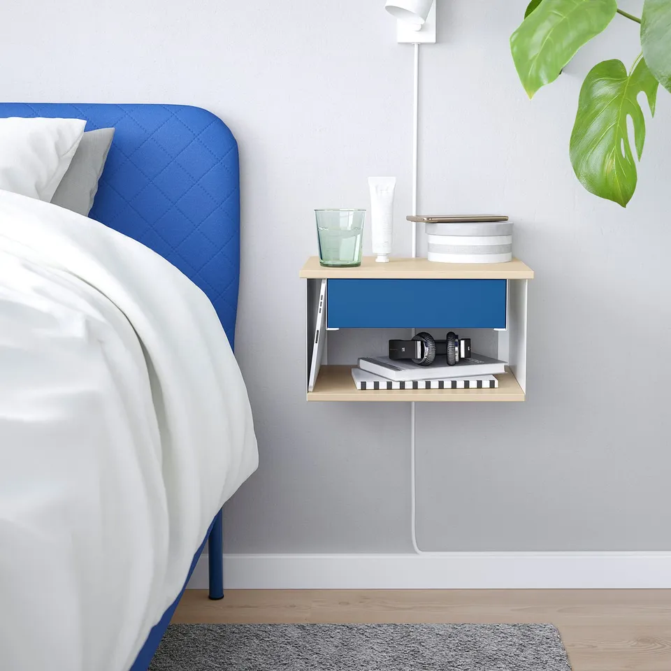 Modern wall-mounted bedside table, wooden & metal, blue accent, small, holds items beside bed.