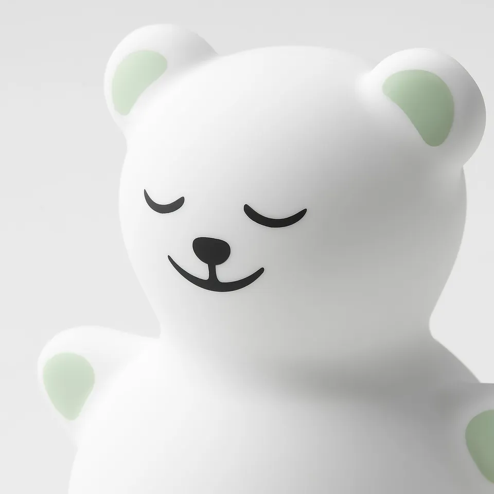 Soft, white, plush teddy bear night light with gentle glow, safe for children.
