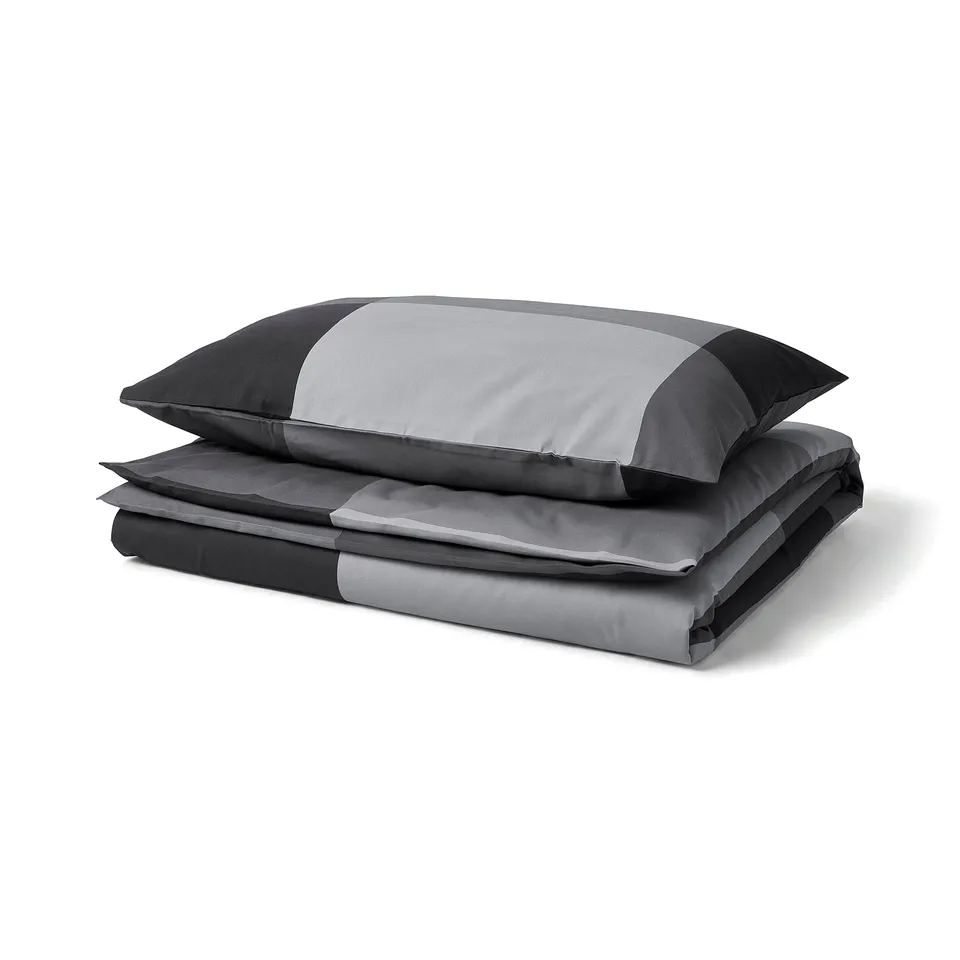 Grey BRUNKRISSLA duvet cover, folded with matching pillowcases, cotton and viscose blend, rectangular with stripes.
