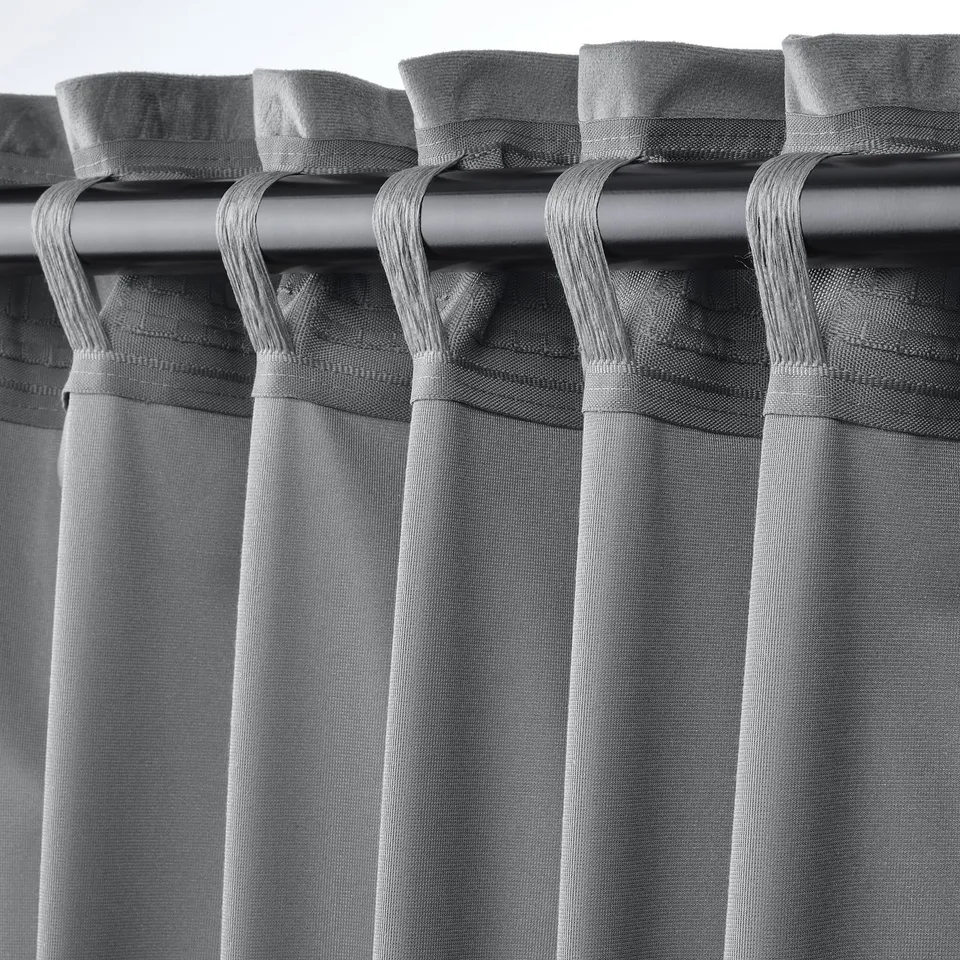 Close-up showing SANDSVINGEL curtains heading tabs for easy hanging and lighting control.