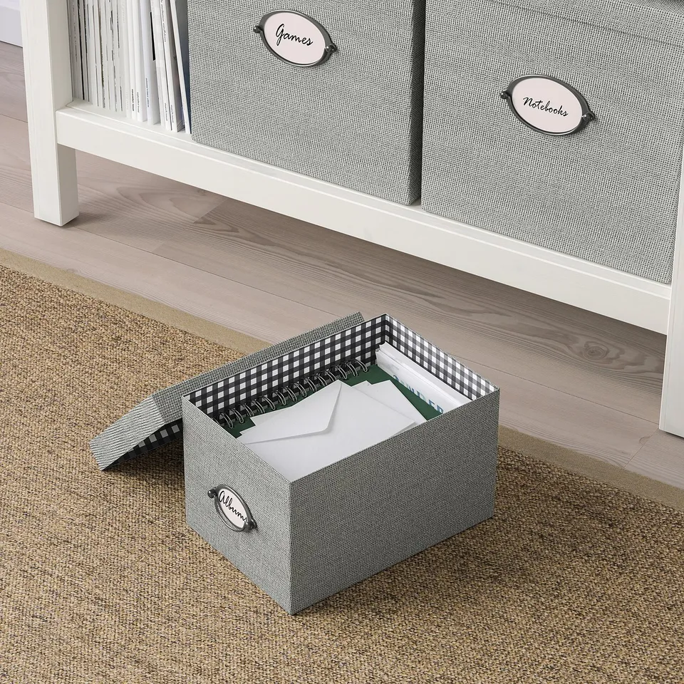 Organiser box outside and inside chequered with albums label, under drawers.