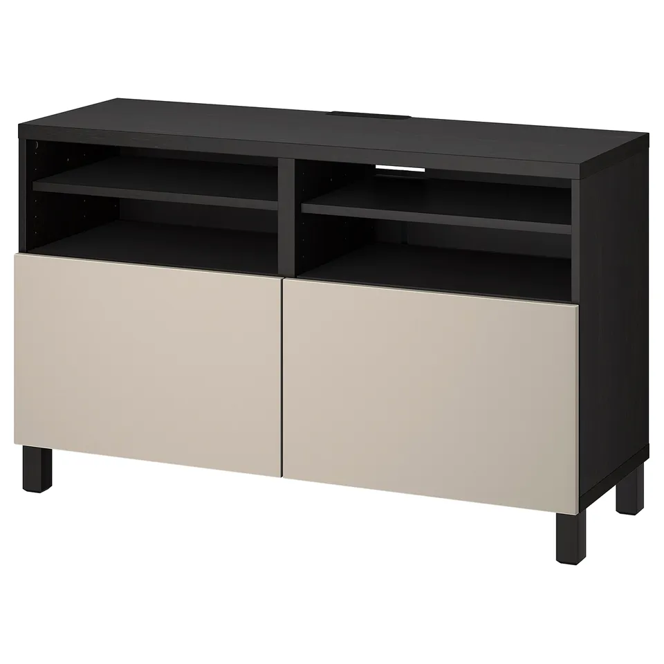 An ikea BESTÅ tv bench in black-brown with beige doors, featuring adjustable shelves and cable management.