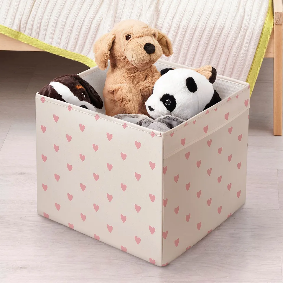 Heart-patterned toy storage box for kallax shelving, holding stuffed animals.