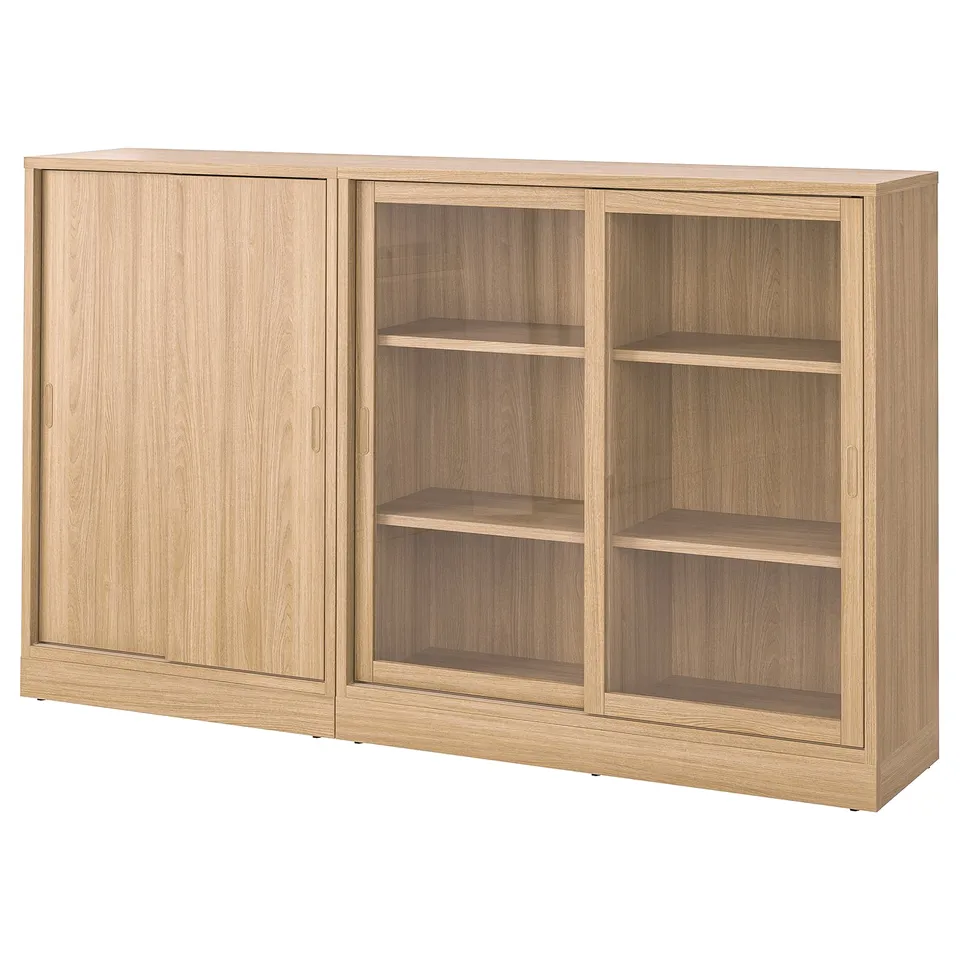 TONSTAD wooden furniture with sliding doors and glass doors in a light oak finish. The unit adjustable shelves and a modern, minimalist design.