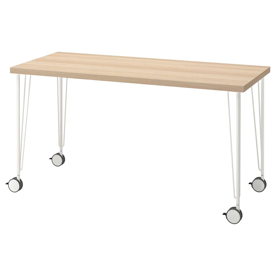 LAGKAPTEN: light wood desk on white legs with castors.
