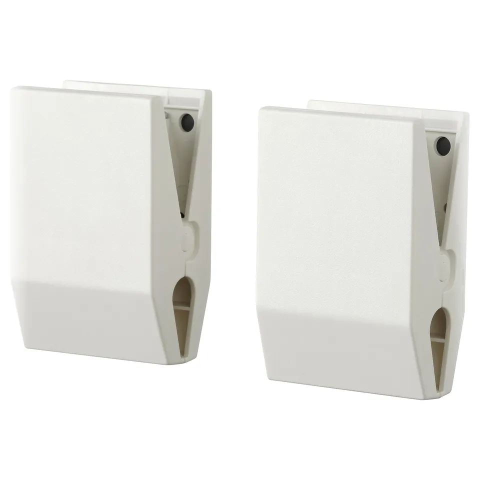 Two white magnetic clips for attaching photos or notes, matte finish, rectangular shape with slits.