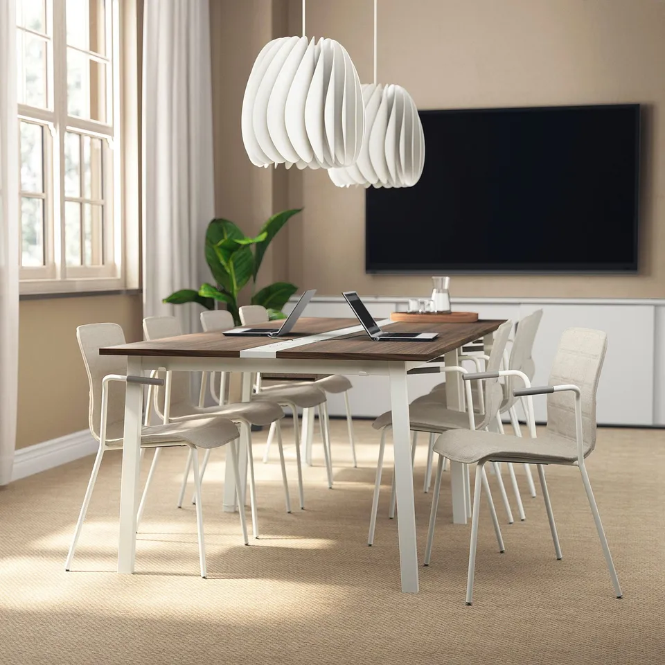 Minimalist conference table MITTZON with tv, plant.