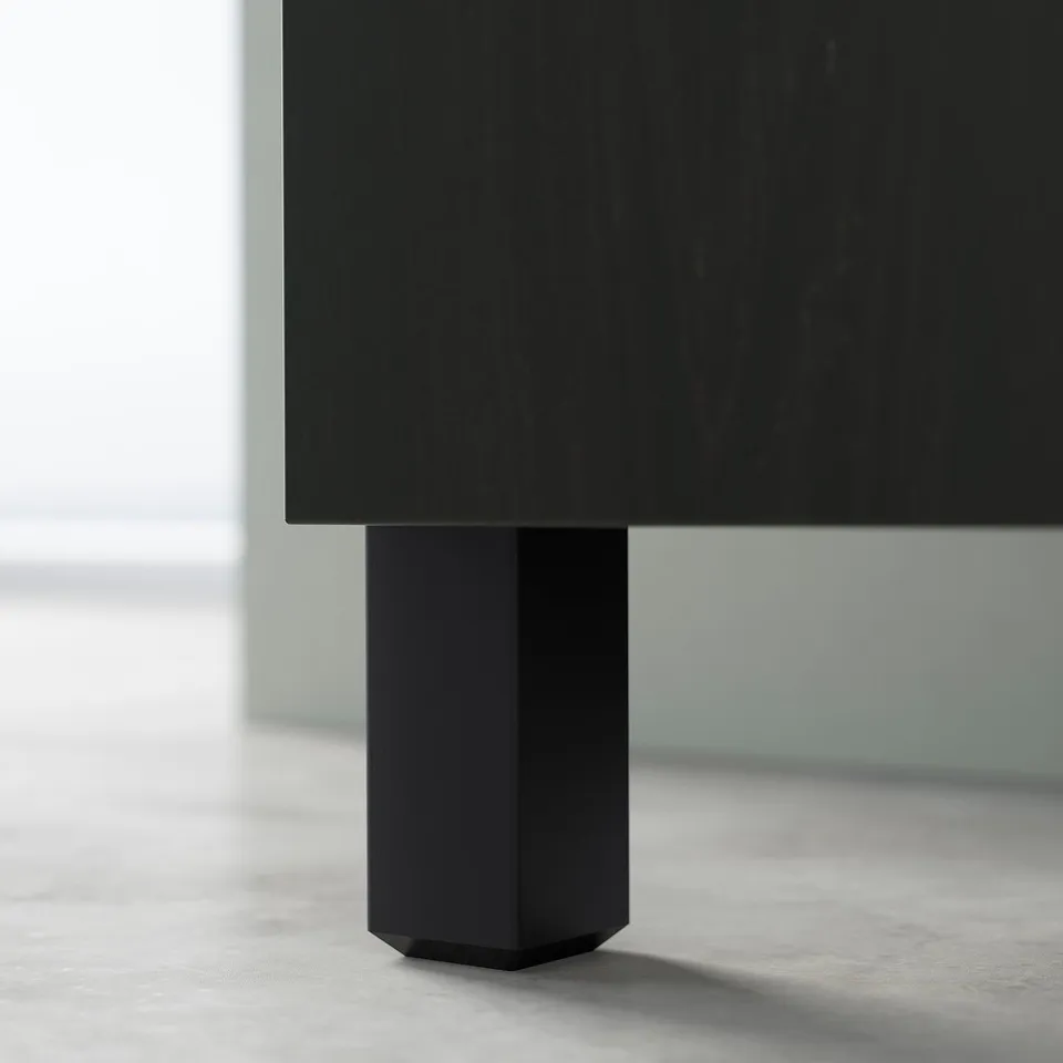 Black BESTÅ sideboard with sleek, hexagonal legs, modern design.