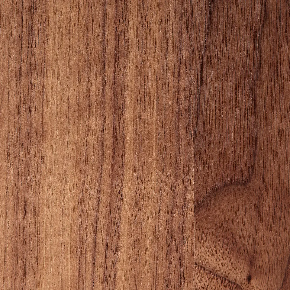 Close-up of polished, dark walnut veneer texture, showcasing fine grain patterns.