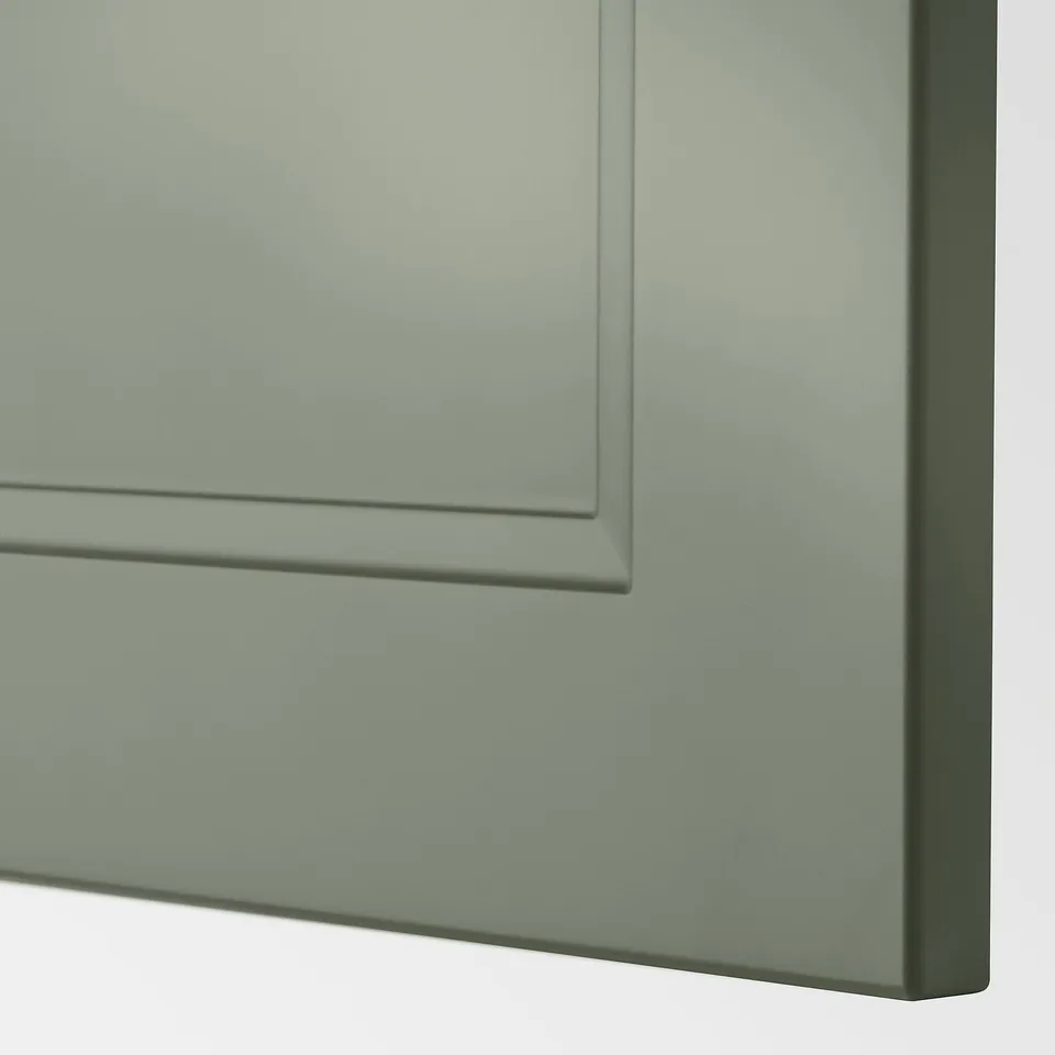 A close-up of a modern, sleek grey-green cabinet drawer from the METOD kitchen system, showcasing its smooth finish and sturdy construction.