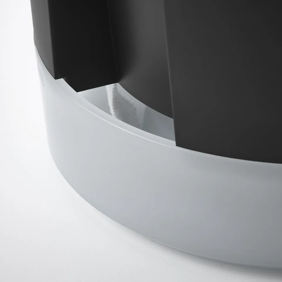 Modern white self-watering planter with sleek design and frosted water gauge.