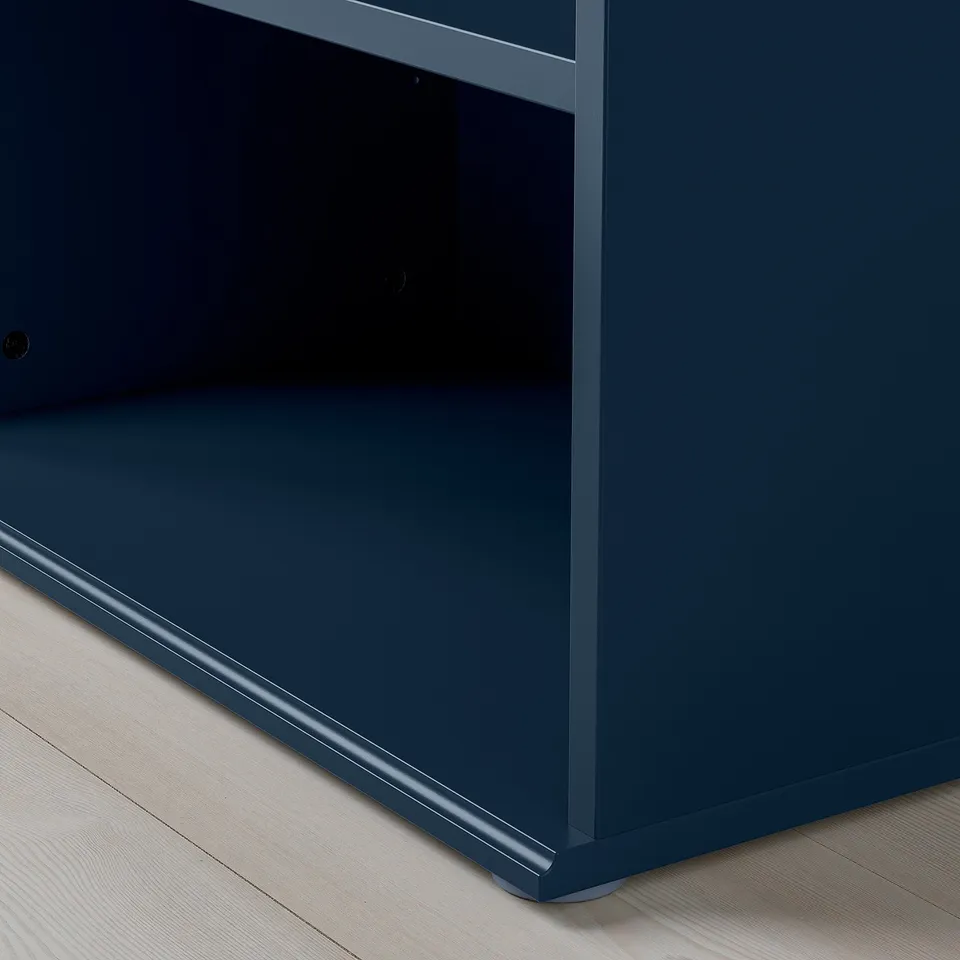Blue cabinet with smooth edges and fine finish on wooden floor.