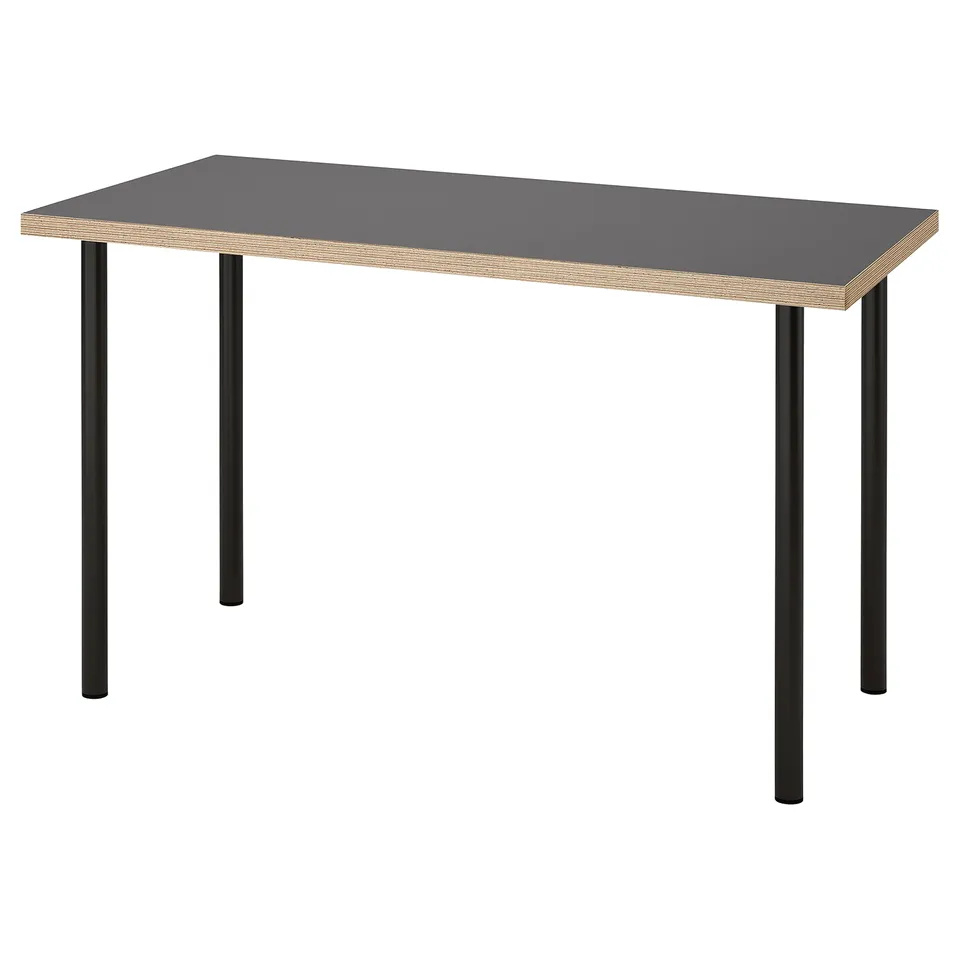 A LAGKAPTEN desk with a grey tabletop and black legs, providing a sleek and modern design.