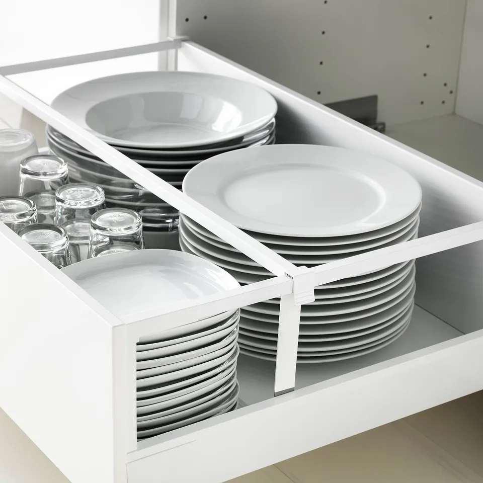 MAXIMERA drawer with dividers, fully extended for easy access. Includes white organisers for plates and glass jars.