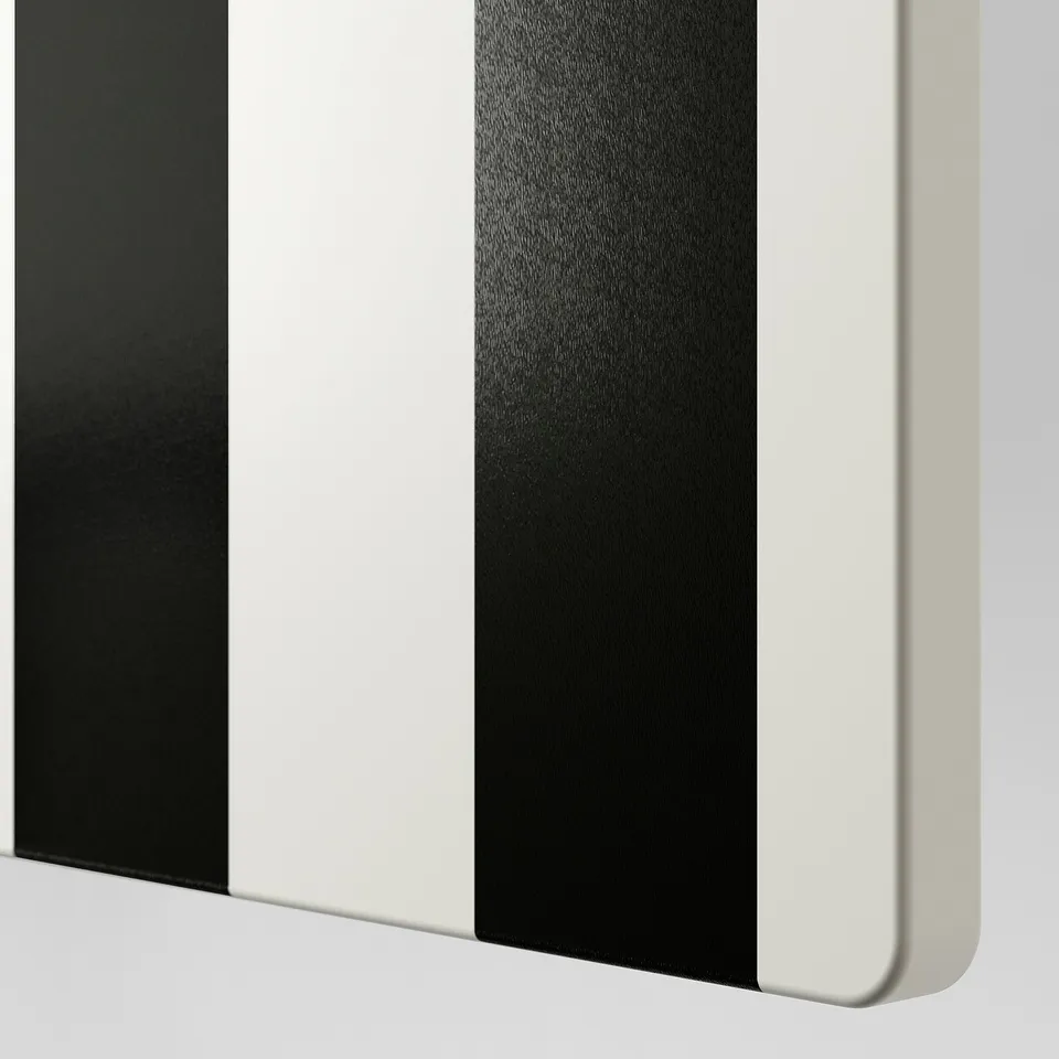 Close-up of a stylish, painted door with bold black stripes and smooth edges.