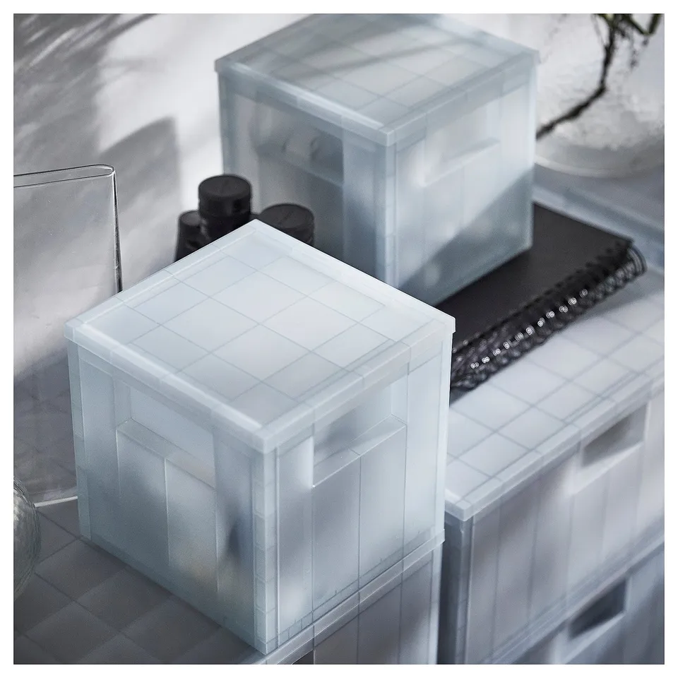 PANSARTAX clear plastic storage box with lid, organising items, rectangular shape, transparent, grid design.
