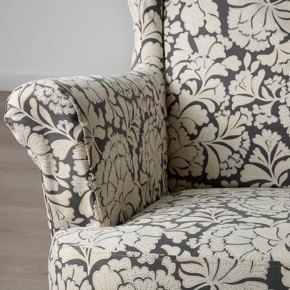Chair with intricate floral print fabric, showcasing high-quality upholstery and design.