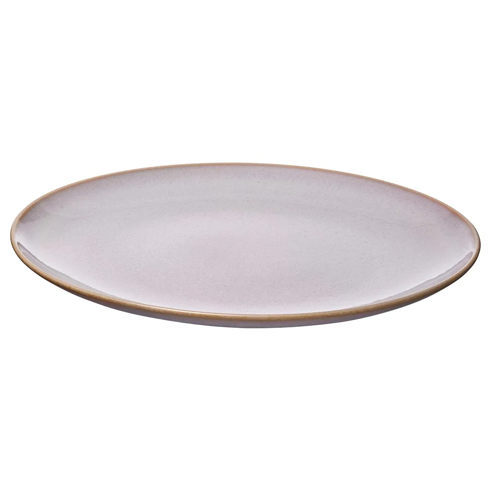 A FÄRGKLAR dinner plate, featuring a simple, round, white design with a subtle speckled pattern. It is made of stoneware with a reactive glaze.