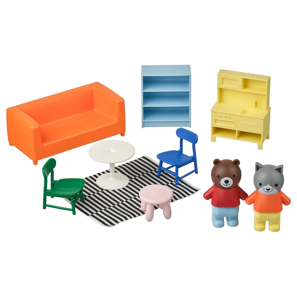 Vibrant mini living room set: orange sofa, blue chair, yellow shelf. Bear and cat figures included. Bright and playful design.