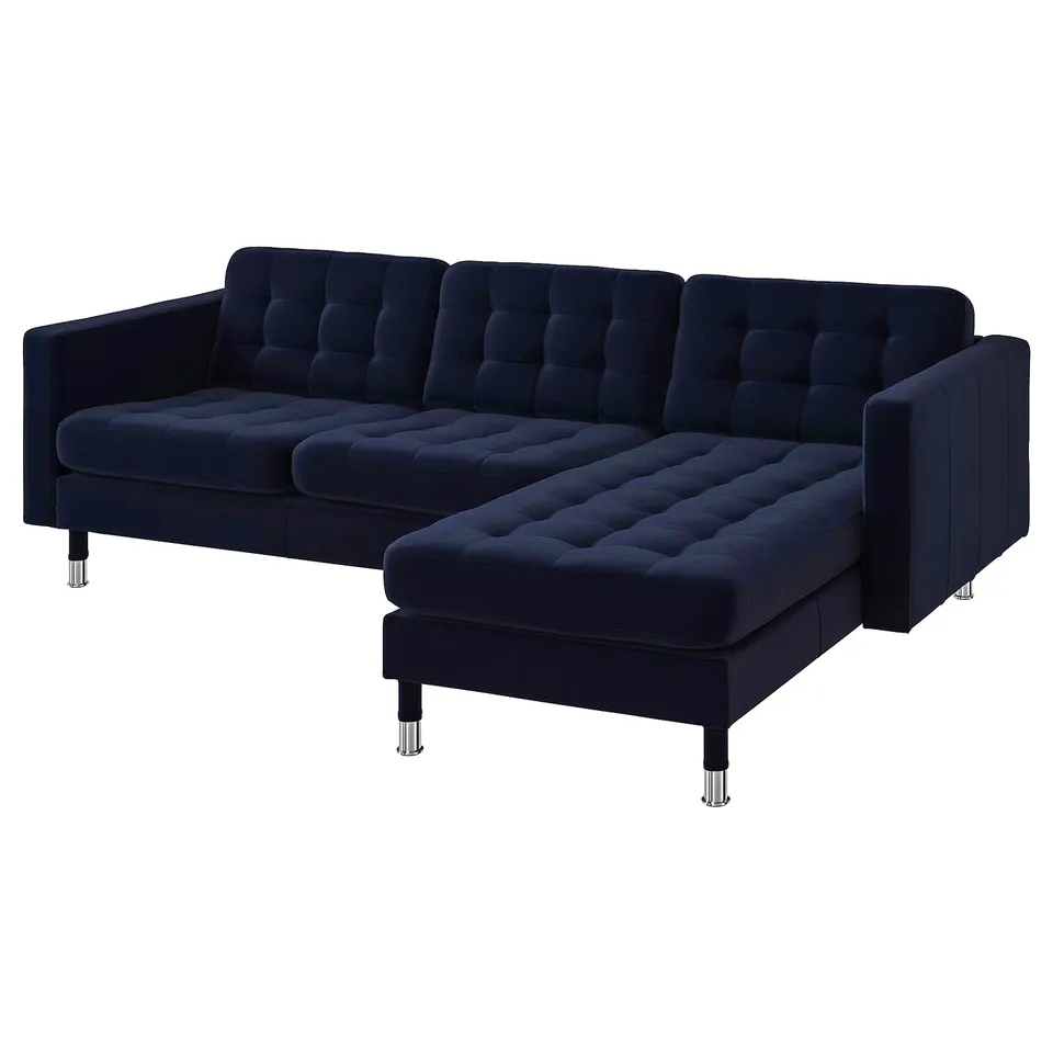 Elegant, deep blue velvet l-shape sofa with tufted cushions, chrome legs, and modern design.
