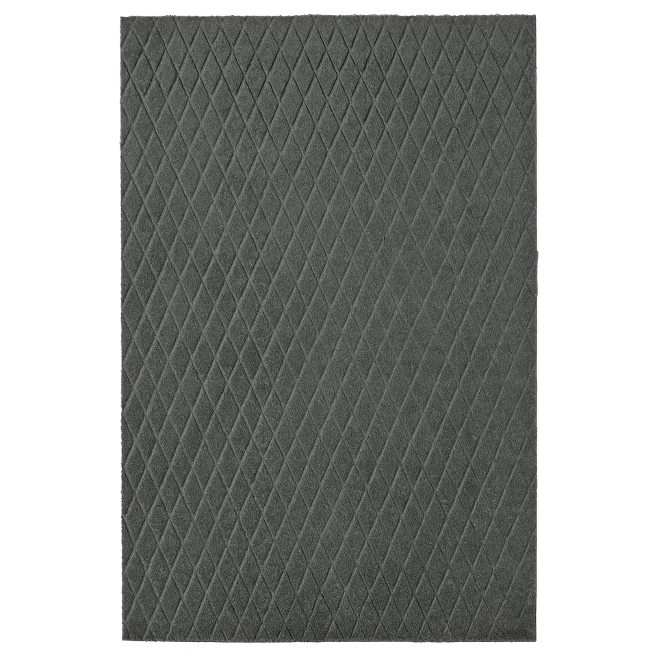 Dark grey rectangular doormat with diamond pattern, made from recycled polyester.