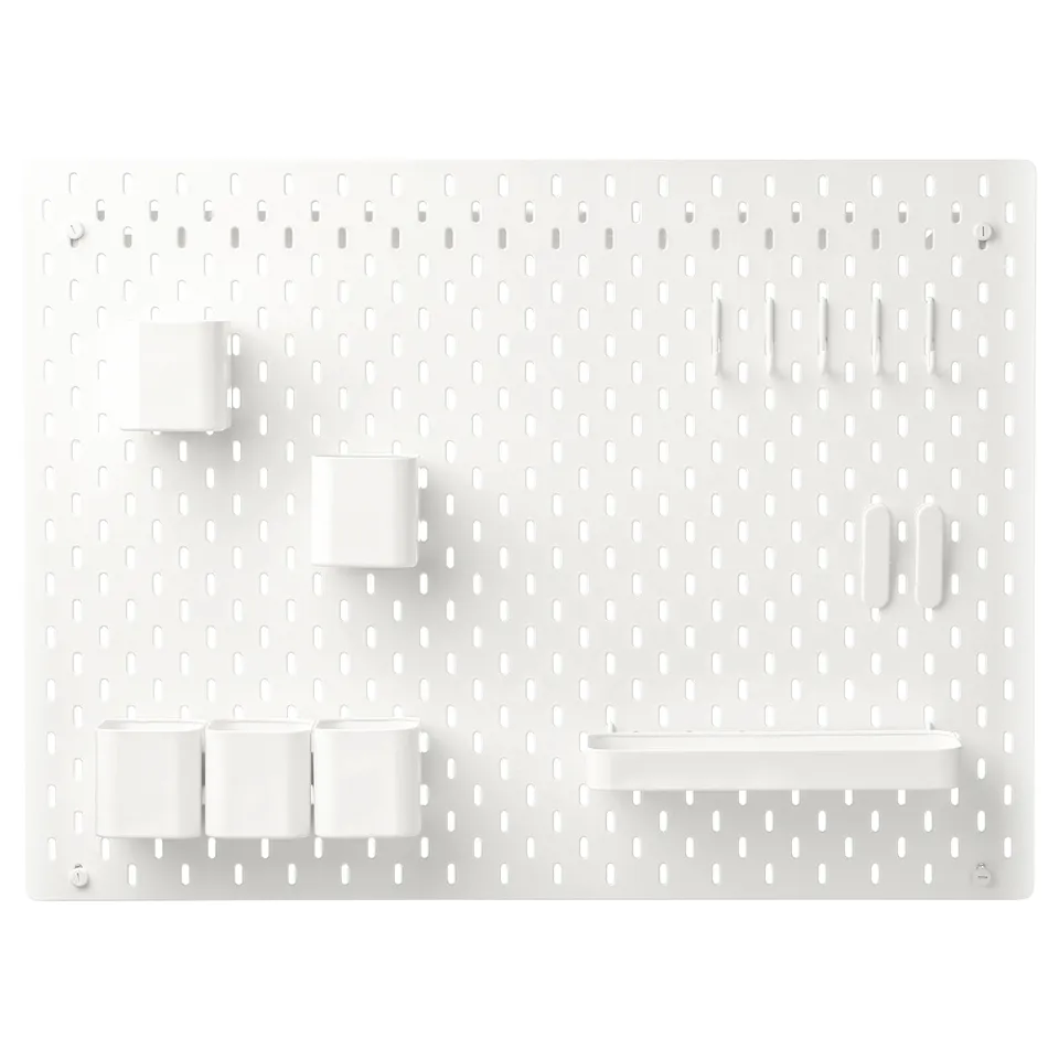 SKÅDIS white wall organiser, pegboard design with containers, hooks, and shelves for organising items.