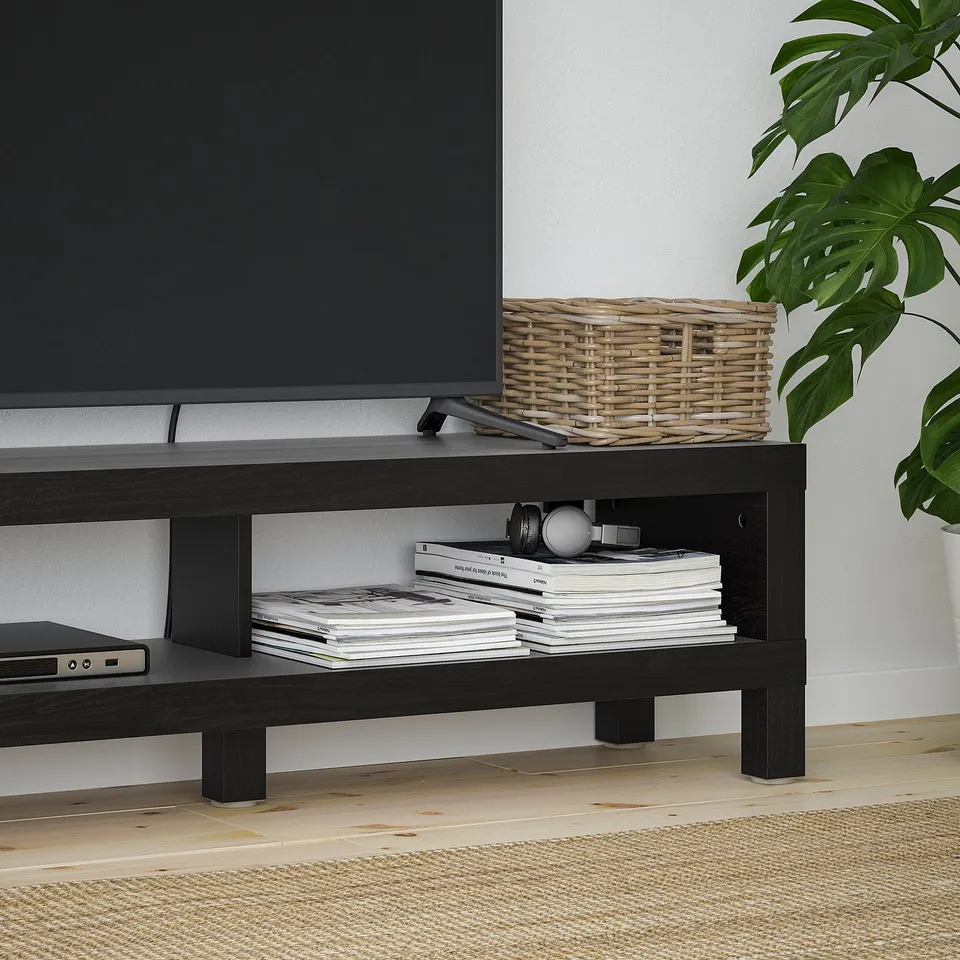 BLACK tv stand with open shelves. Holds magazines and electronics. Basket and plant decorate top.