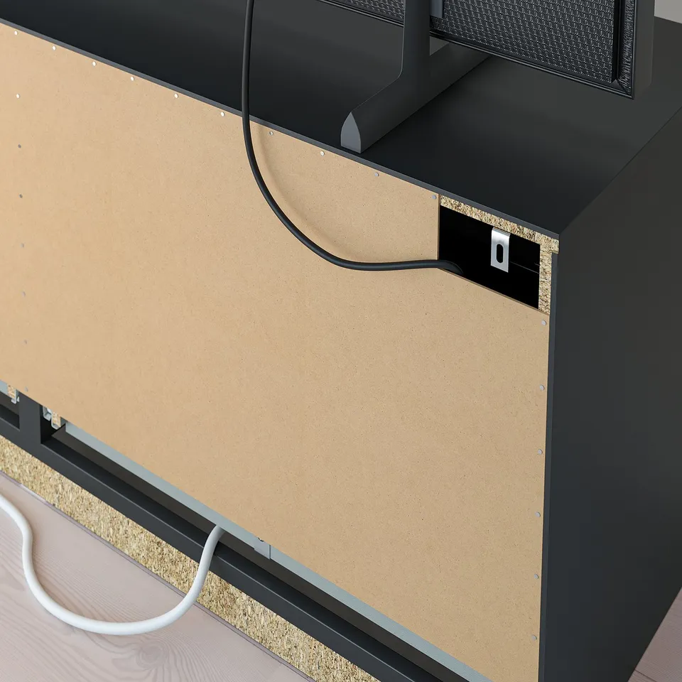 A tv bench with adjustable shelves, cable outlets, and drawers for storing tv accessories.