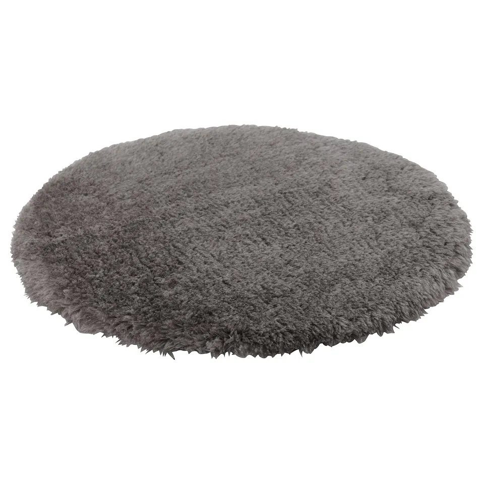 Round grey chair pad, soft with sheepskin-like recycled polyester, non-slip bottom.