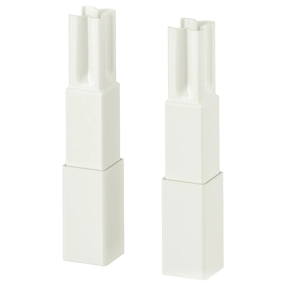 Two white ENHET legs for kitchen base frames, featuring a sleek, modern design with adjustable height for stability and easy cleaning.